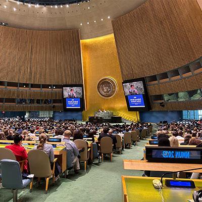 image of students at model United Nations event listening to a speaker